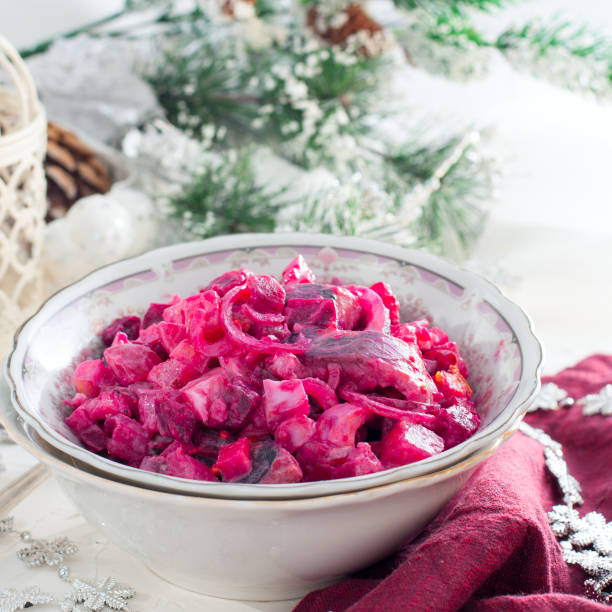 istock Beet salad with herring and apples on wooden background,square 1037493480