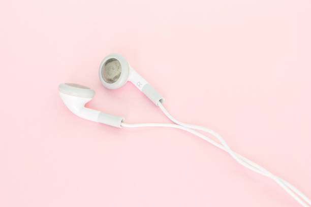 istock earbuds or earphones on pink background 1037501198