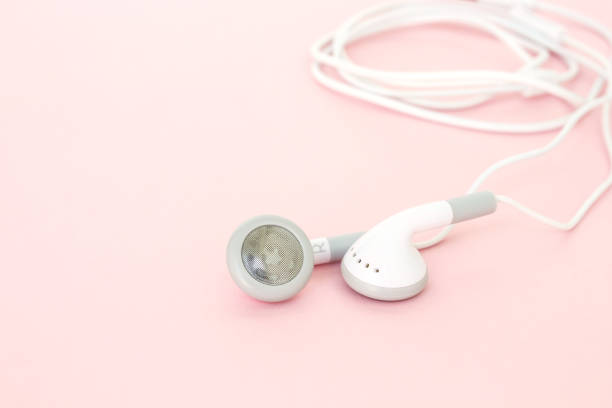 istock earbuds or earphones on pink background 1037501360