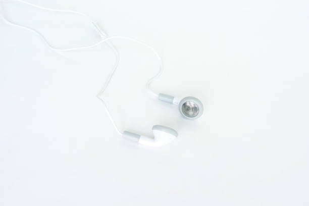 istock earbuds or earphones top view on white background 1037501478