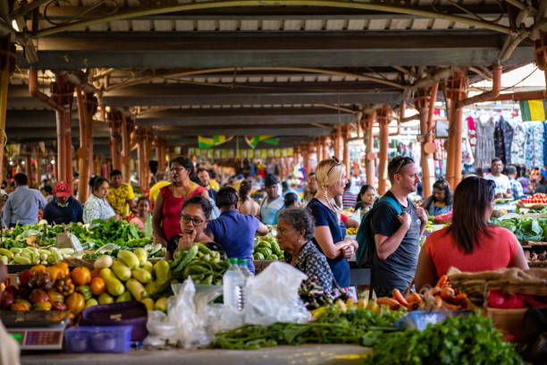 Both locals and tourists flock to the Wednesday and Sunday markets at Centre de Flacq, the main town in the east of Mauritius in the Indian Ocean. It is conveniently located directly opposite the main bus station and, like most markets throughout the world, is vibrant, crowded and noisy. The huge market is all under cover and sells locally grown produce as well as clothing, household goods and a few souvenirs. There is a small area to the rear of the market were shoppers can relax at tables with a glass of fresh coconut milk.