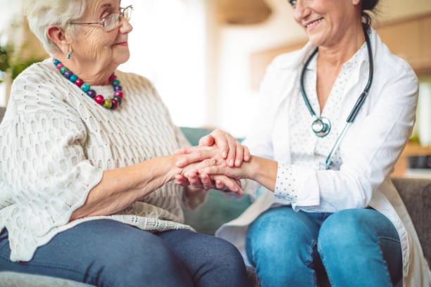 istock Social worker is visiting a senior woman 1037524780