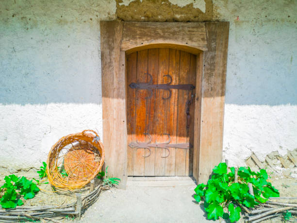 Old wooden door and stone wall. Zaporozhye, Ukraine, 22 August 2018.