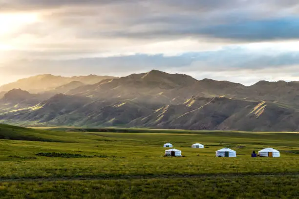 ger is traditional house of mongol.
some gers are in grass land.
you can see beautiful clouds above it