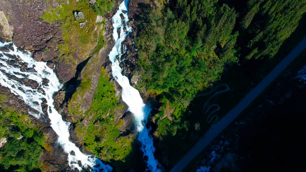 aerial view of waterfall latefossen at sunset lights in summer, norway - bridge norway odda falling imagens e fotografias de stock