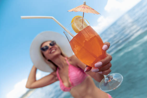 istock Beautiful woman enjoying on the beach 1037576552