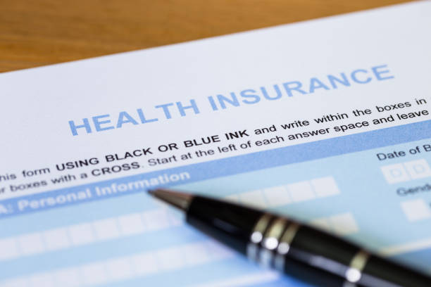 istock Health insurance application form with pen concept for life planning 1037585482