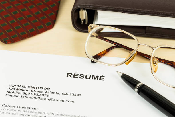 istock Resume, pen, neck tie, glasses, and notebook 1037585558