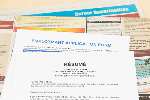Resume on classify newspaper concept job applying