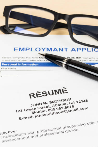 istock Resume with pen and glasses concept job applying; documents are mock-up 1037585642