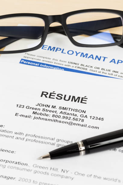 istock Resume with pen and glasses; resume, document, and information are mock-up 1037585666