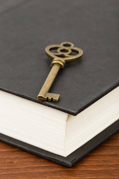 istock Antique key on book cover 1037591922