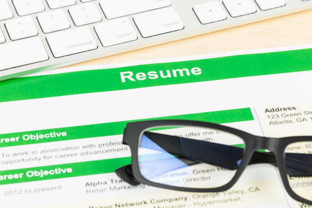 istock Resume with keyboard and glasses; document and information are mock-up 1037592096