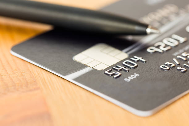 istock Pen on black credit card 1037592118