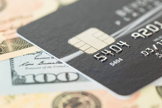 istock Black credit card on dollar banknote 1037592148