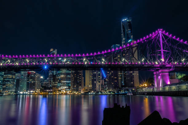 istock Illuminated bridge in metropolitan city 1037593426
