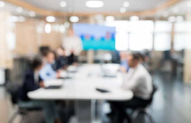 istock Soft Focus Business People Sitting In Conference Room 1037604556