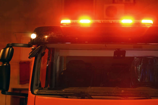 istock red lights on top of Fire engine car 1037604916