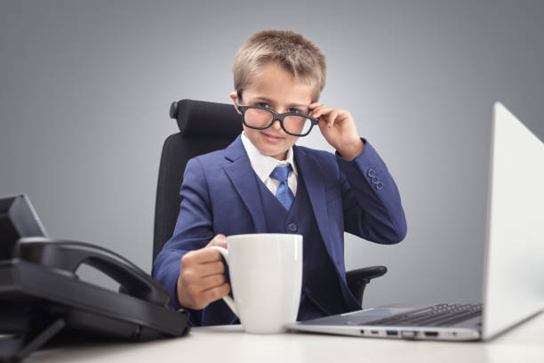 Young confident executive businessman boss boy in office