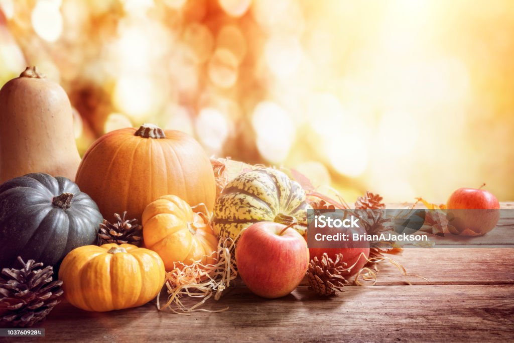 Thanksgiving, fall or autumn greeting background with pumpkin Thanksgiving, fall or autumn greeting background with pumpkin on table Thanksgiving - Holiday Stock Photo