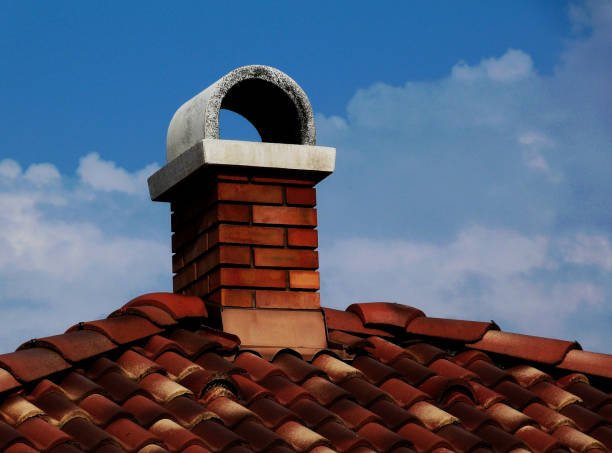 istock terracotta clay tile roof abstract with blue sky above 1037612806