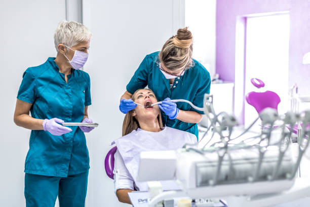 istock Woman at Dentist with patient 1037623444