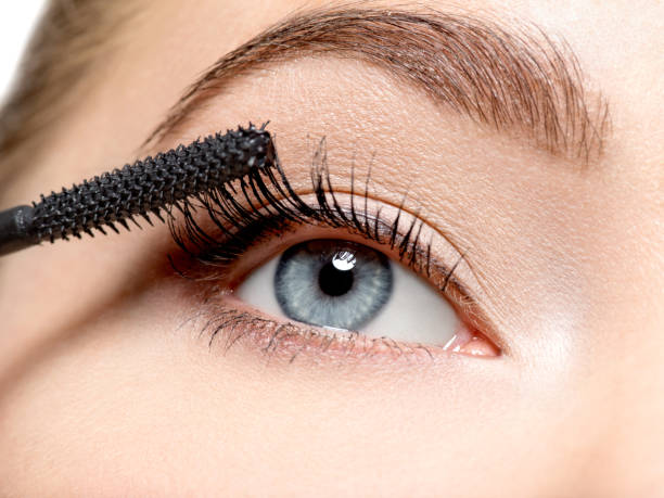 istock women eye with long black eyelashes and makeup brush 1037625014