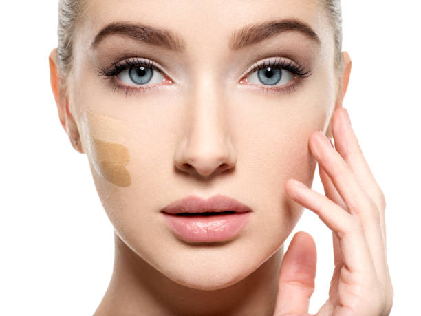 istock Young woman with cosmetic foundation on skin. 1037626222
