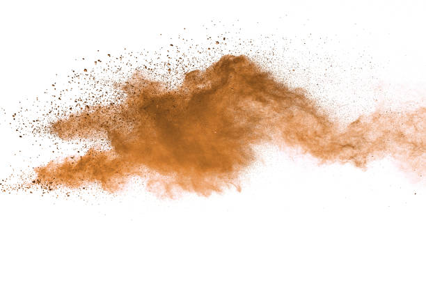 istock Abstract brown colored soil splash on white background. Color dust explode on background by throwing freeze stop motion. 1037633398