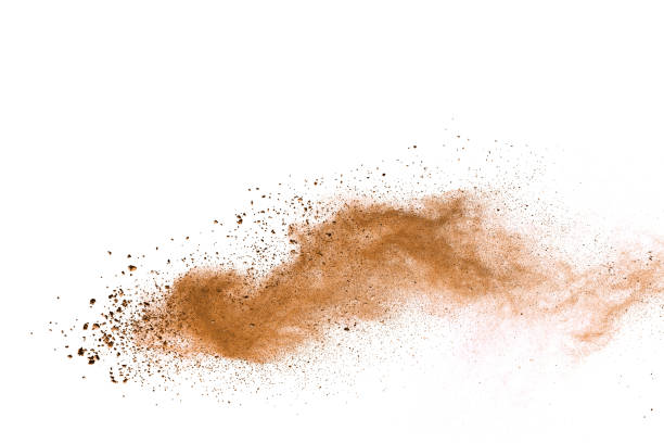 istock Abstract brown colored soil splash on white background. Color dust explode on background by throwing freeze stop motion. 1037633474