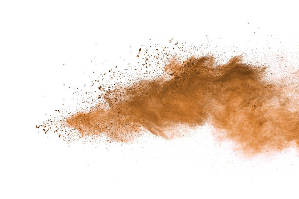 Abstract brown colored soil splash on white background. Color dust explode on background by throwing freeze stop motion. Abstract brown colored soil splash on white background. Color dust explode on background by throwing freeze stop motion. dust stock pictures, royalty-free photos & images