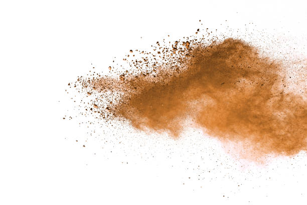 istock Abstract brown colored soil splash on white background. Color dust explode on background by throwing freeze stop motion. 1037633638