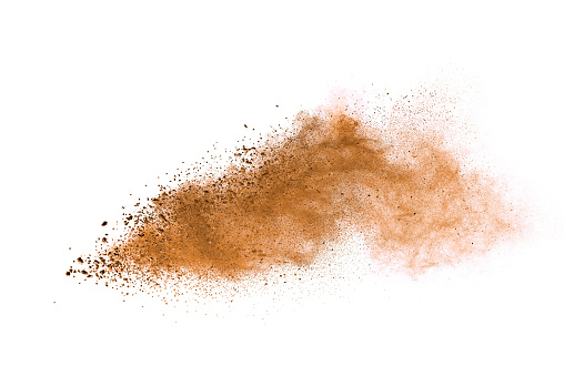 Abstract brown colored soil splash on white background. Color dust explode on background by throwing freeze stop motion.