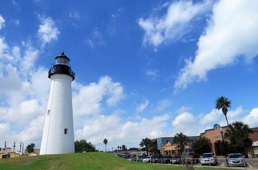 Port Isabel, Texas, USA – September 12, 2018:  Port Isabel, on the Gulf of Mexico coast, has beautiful sandy beaches, hotels, restaurants, entertainment, and a plethora of water sports recreation.Point Isabel Lighthouse in Port Isabel, on the Gulf of Mexico coast, is the only lighthouse in Texas open for tourists to visit. From the top of the lighthouse visitors can get the best aerial views of Port Isabel, Queen Isabella Causeway, and South Padre Island. South Padre Island is visible from Port Isabell, and accessible by driving across the Queen Isabella Causeway.