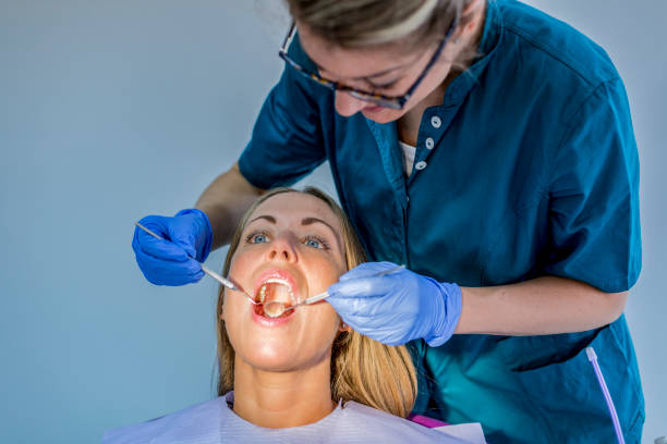 istock Woman at Dentist with patient 1037644182