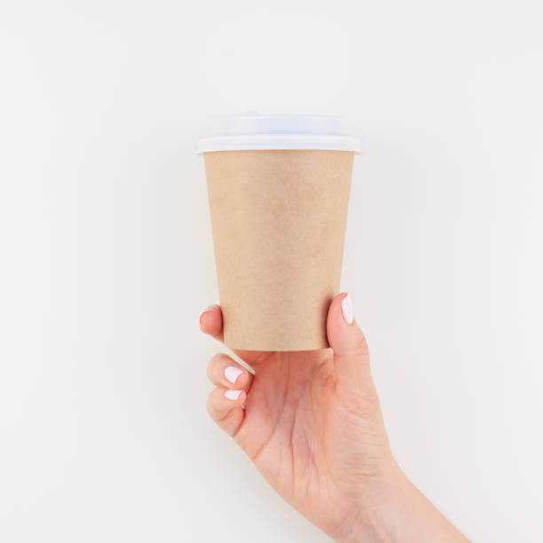 istock Mock up of coffee cup in female hand 1037646998