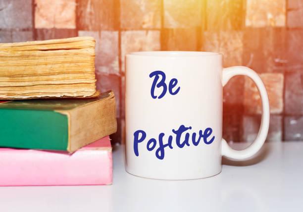 istock be positive Coffee Cup and books Concept 1037655988