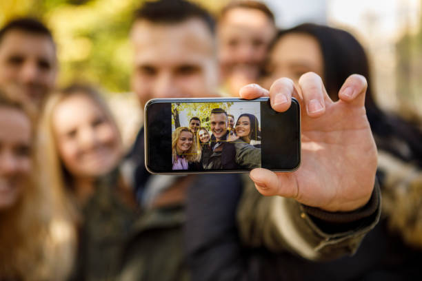 istock Group of friends making selfie 1037656156