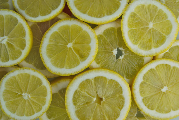 istock BACKGROUND OF LEMON SLICES 1037666714