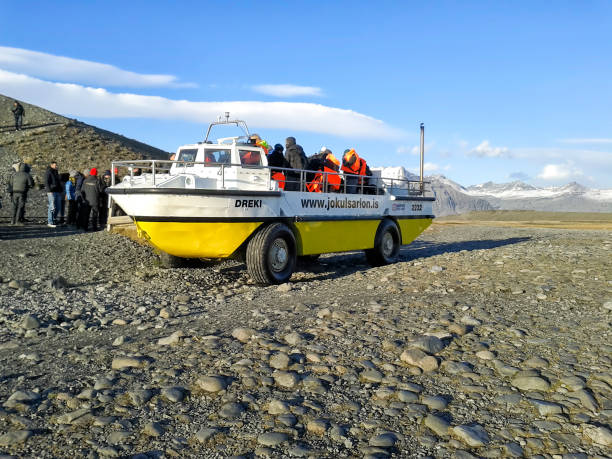 October 10, 2014: The Amphibian boat ice taste at Jökulsárlón Glacier Lagoon, Vatnajökull National Park, Höfn, Iceland South Coast October 10, 2014: The Amphibian boat ice taste at Jökulsárlón Glacier Lagoon, Vatnajökull National Park, Höfn, Iceland South Coast amphibious vehicle stock pictures, royalty-free photos & images