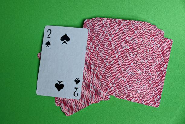 istock a deck of red cards with a peak deuce on a green table 1037673914