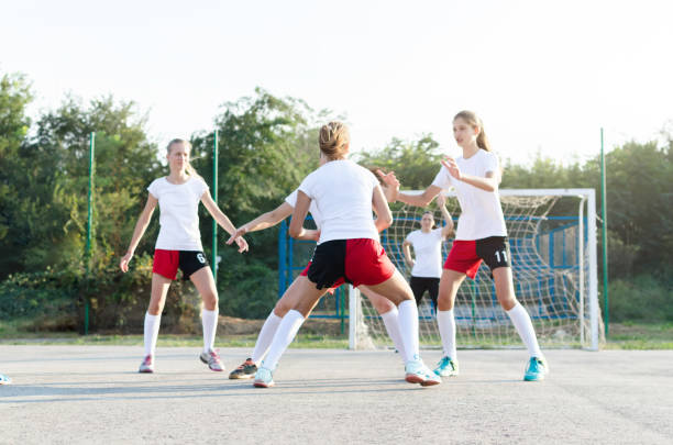 istock Female handball team playing a match 1037674176