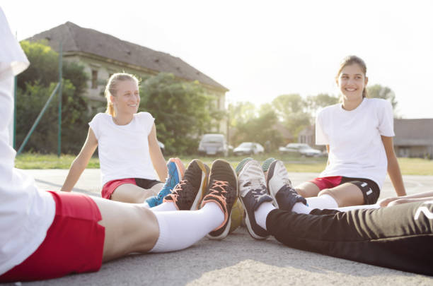 istock Female handball team taking break 1037674194