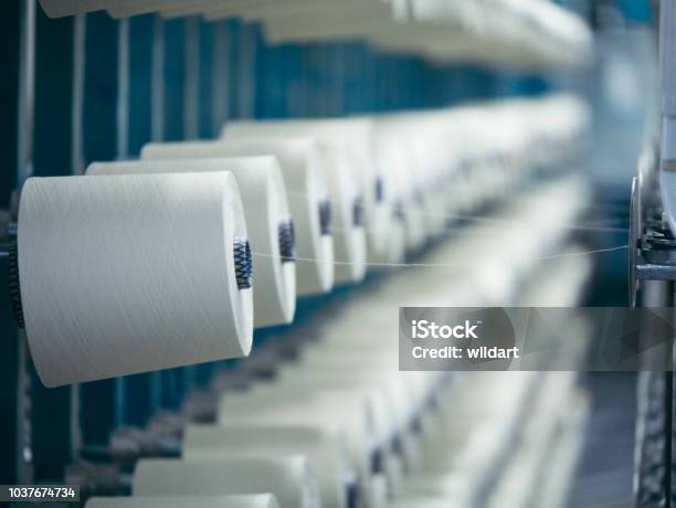 White Yarn Spools Of Industrial Warping Machine In Textile Factory Stock Photo - Download Image Now