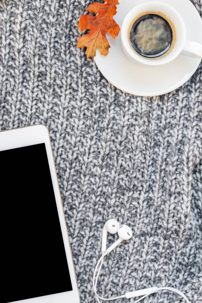 istock Home workplace with coffee cup on knitted plaid 1037676852