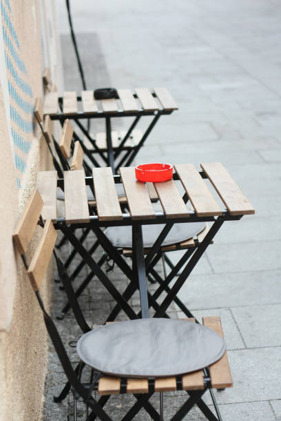 istock Sidewalk cafe outdoor chairs 1037690520