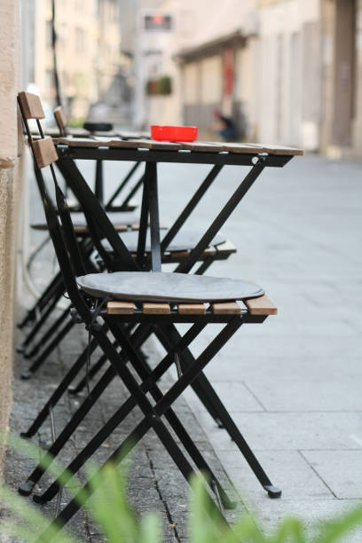 istock Sidewalk cafe outdoor chairs 1037690536