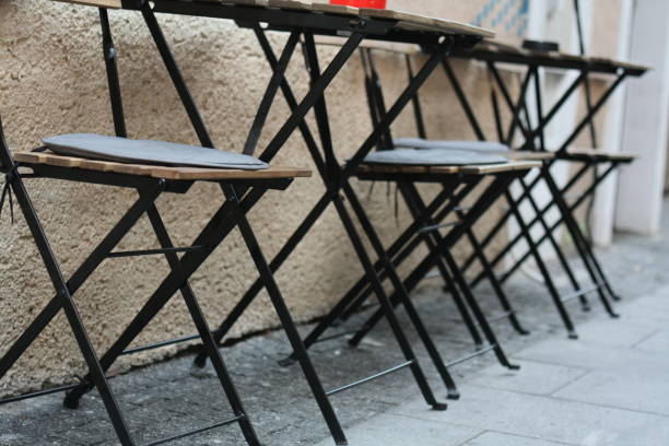 istock Sidewalk cafe outdoor chairs 1037690560