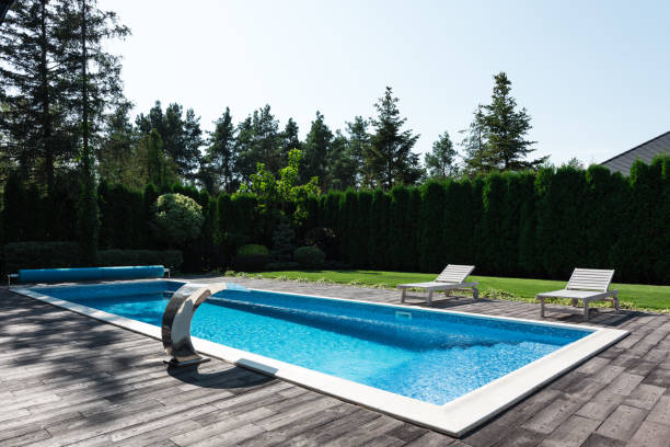 istock view of poolside with sunbeds and green lawn 1037712866