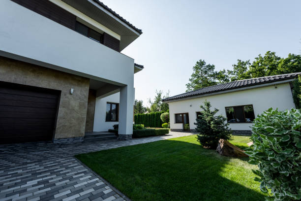istock modern private house with green lawn and garden 1037712948
